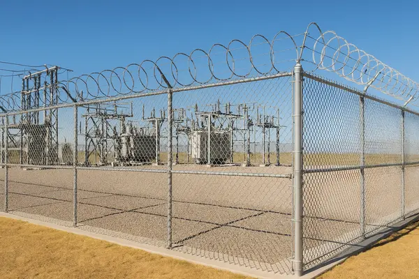 an electric substation surrounded by a chain fence from LEANDER FENCE REPAIR in Leander, TX - Chain Fence Installation
